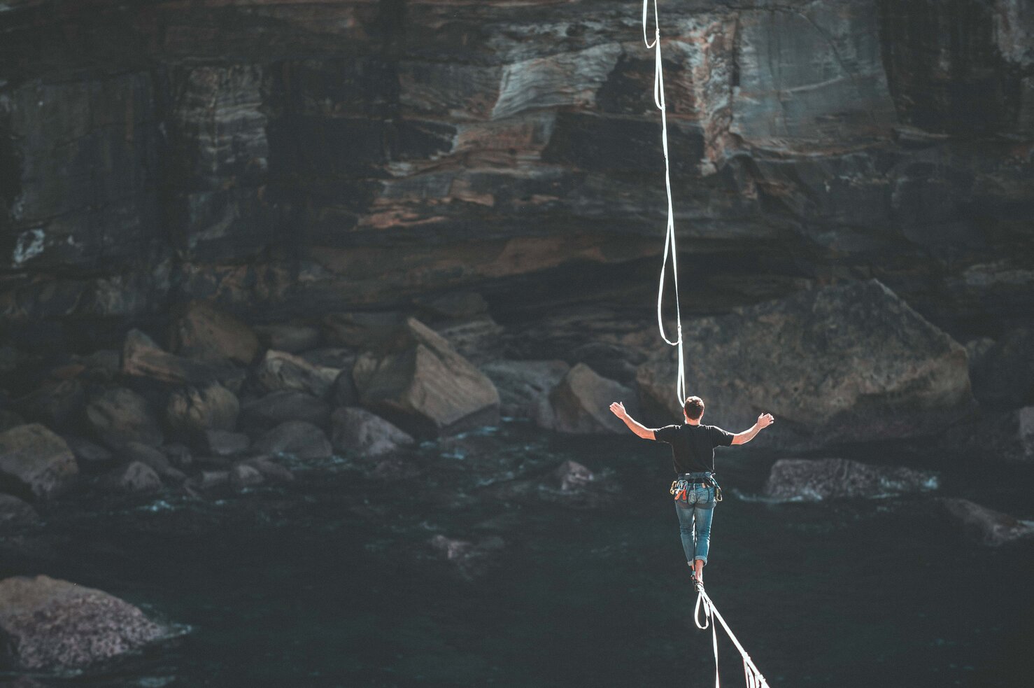 balancing risk on a tightrope in the mountains